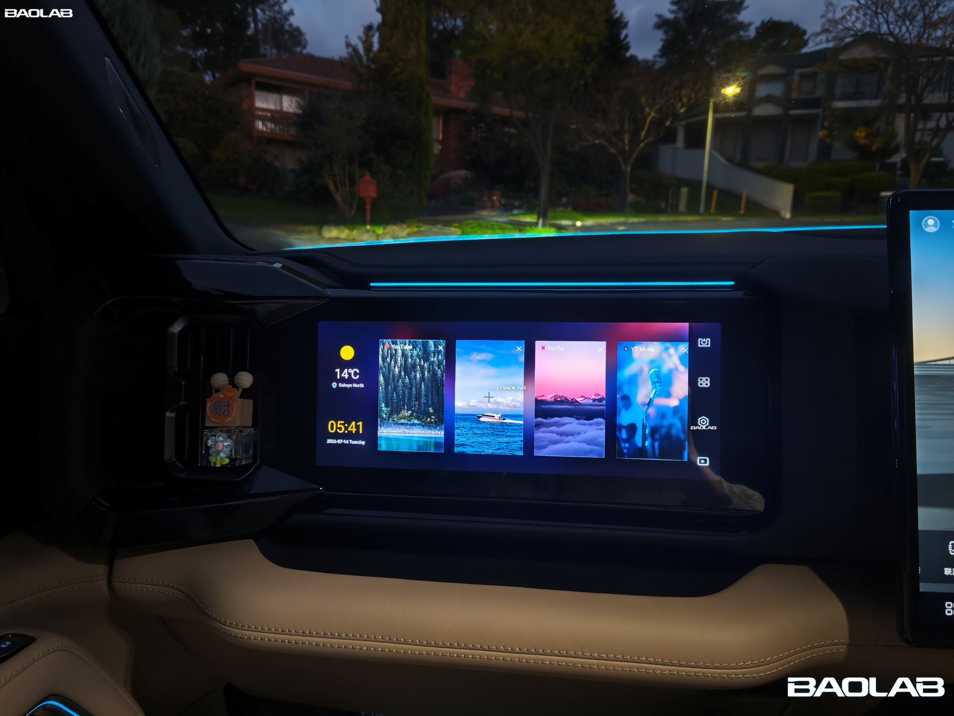 Denza B8 interior showcasing the passenger entertainment screen at night
