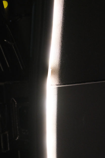 Close-up detail of the BAOLAB hidden perimeter boot light installed along the Denza B8 boot trim, showing the smooth continuous light output.